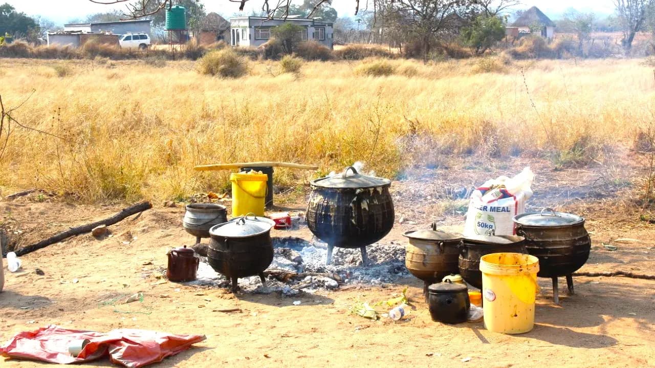 Large pots cooking for a funeral gathering